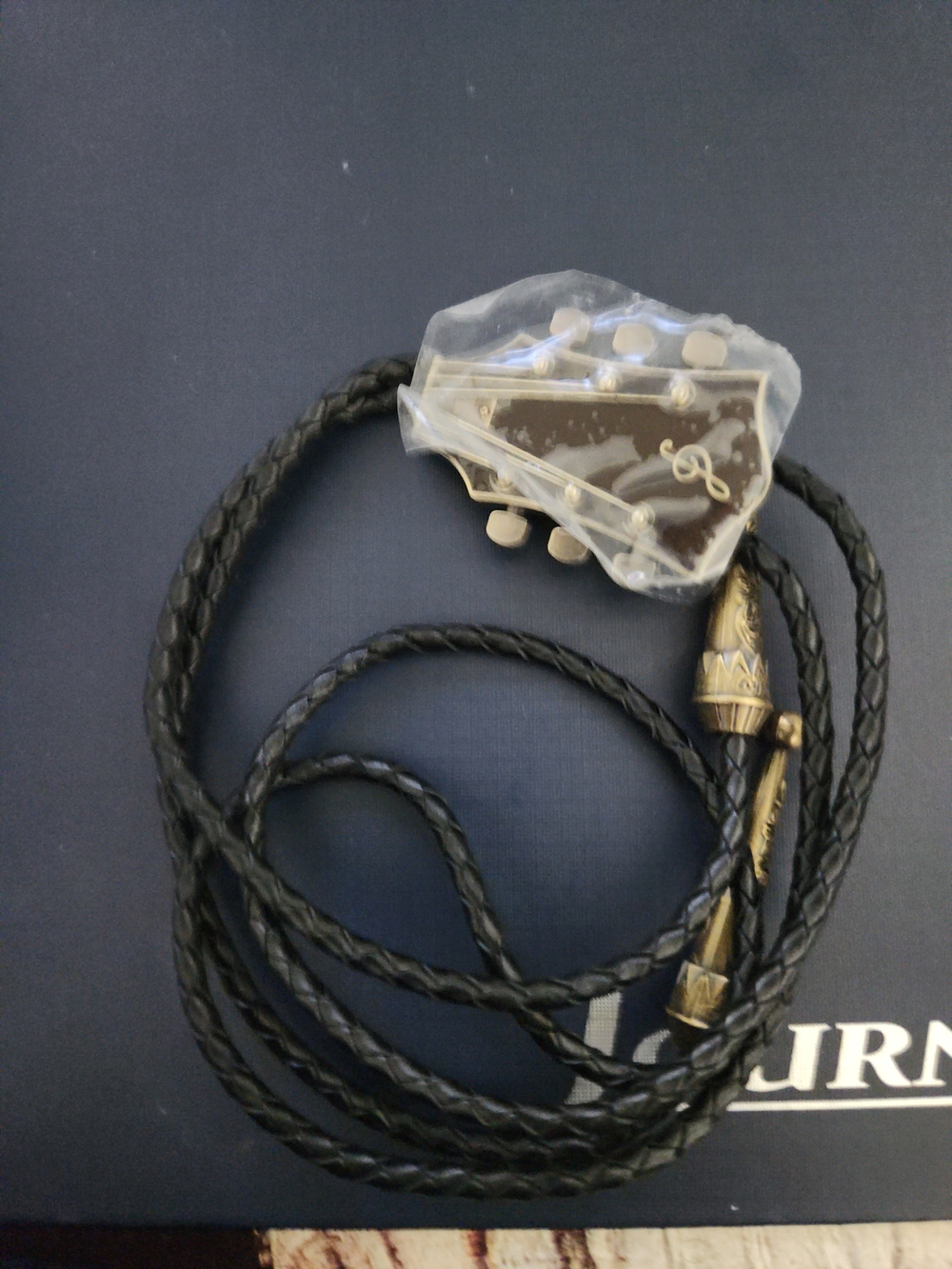 Braided Leather Bolo Tie with Guitar Head Design - Black and Gold